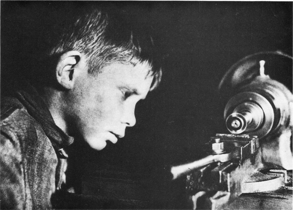 K. Kuznetsov: Young communards working in the Dzerzhinsky Commune machine shop in 1934. (From &#39;USSR in Construction&#39;, April 1934.) - f11b